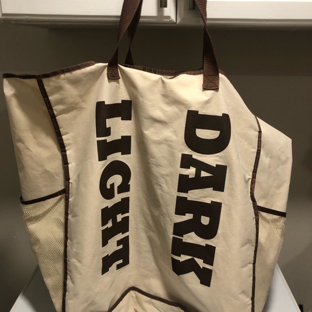 Laundry sort bag with side pockets.